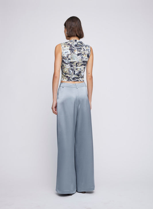 Wide-Leg Steel Satin Dress Pant featuring front pleating. High waist silhouette is constructed with front pleating, cut wide for fluid movement. Elevate your everyday wardrobe with this chic and versatile piece. Try for a day look with a basic top or match with the Mason Shirt for a dinner pant or party look. Dinner pant, event pant, everyday pant, wide-leg pant, dressy wide-leg pants.