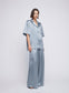 Satin Oversized Camper Collar Short Sleeve Shirt ‚Äö√Ñ√∂‚àö√ë‚àö‚àÇ‚Äö√†√∂‚àö√´‚Äö√†√∂¬¨¬Æ an relaxed oversized satin shirt, designed with a boxy shoulder, camper collar, breast pocket, and back yoke. Wear with the wide leg matching Mateo Pant. An elevated everyday look worn with sandals or go from day-to-night and pair with heels for a dinner matching set, dinner shirt, party set or event set.